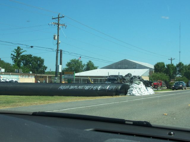 Stephensville Elementary School surrounded by a tube barrier filled with water for flood protection.