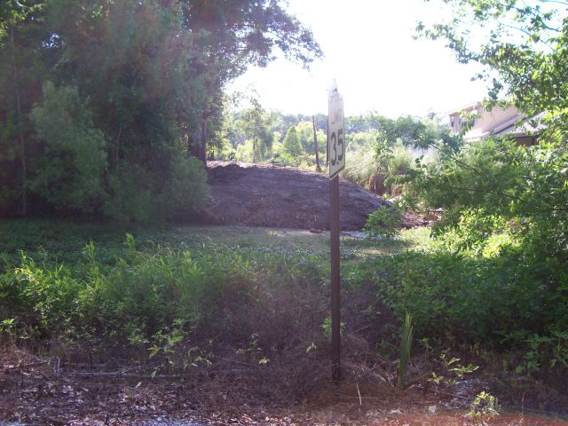 Construction of dirt levee in Gibson to protect a low vulnerable area.